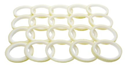 Several sliced onion rings are stacked in neat rows showing their circular shape and translucent texture.