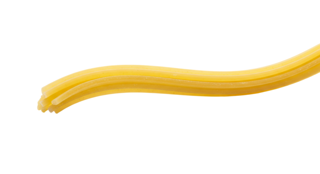 Spaghetti strands are stacked closely together in a curve against a stark background.