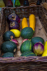 Colorful market stand featuring fresh tomatoes, eggplants, zucchinis. A vibrant showcase of organic produce emphasizing freshness and diversity of vegetables. High quality photo