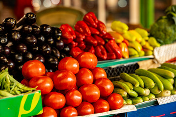 Colorful Fresh Vegetables Displayed On Market Stalls In Kutaisi Georgia: Tomatoes, Peppers, Eggplants, Onions And Cucumbers Symbolizing Local Harvest And Traditional Food Culture