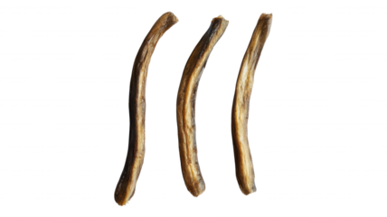 Three brown curved sticks isolated on a black background