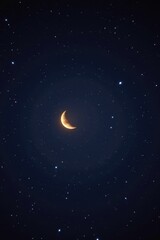 Fototapeta premium A luminous crescent moon hangs in the dark, starry night sky, bright light, expanse