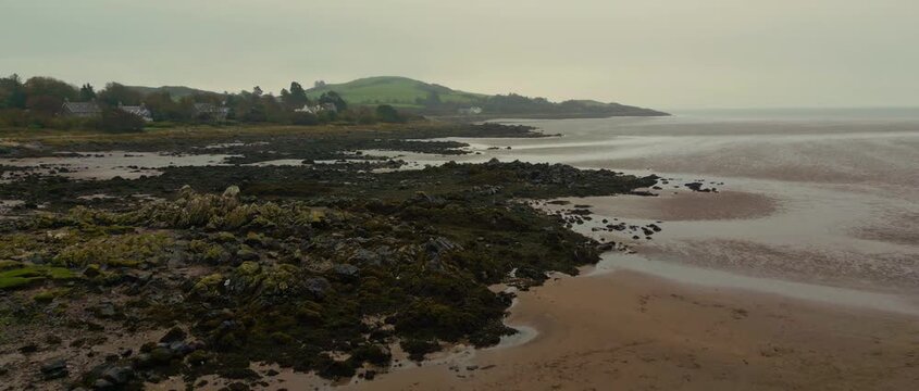 Aerial Video of Rockcliff Scotland UK. Rockcliffe is a small, coastal village in Kirkcudbrightshire, Dumfries and Galloway in Scotland, with a view of Rough Island, Hestan Island, the Solway Firth.