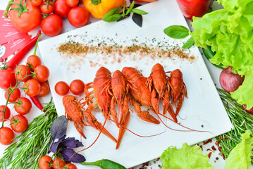 boiled crayfish large on a white plate on a table with food decor