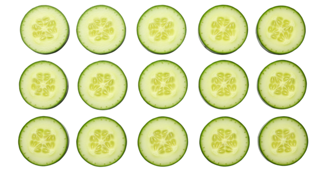 Cucumber slices are arranged in rows, creating a pattern against a surface. - high quality Cucumber slices are arranged in rows, creating a pattern ag