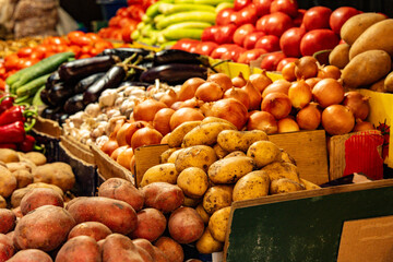 Colorful Fresh Vegetables Displayed On Market Stalls In Kutaisi Georgia: Tomatoes, Peppers, Eggplants, Onions And Cucumbers Symbolizing Local Harvest And Traditional Food Culture