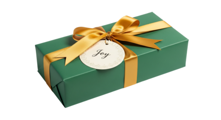 Green gift is wrapped with gold ribbon and 'Joy' tag resting on surface. - high quality Green gift is wrapped with gold ribbon and 'Joy' tag resting o