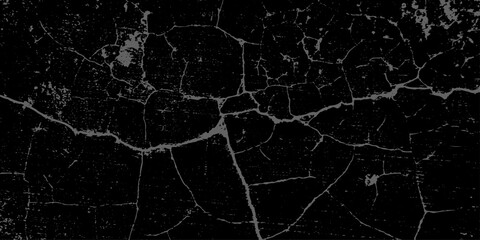 Black and white grunge cracked earth desert texture. a rough, old cracked concrete wall surface with a grunge distressed background texture. old damage and dirty overlay texture with grunge effect.