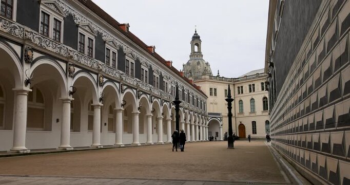 Dresden Germany city Stallhof walking. Industrial center of East Germany, now unified German, European Union (EU) and NATO. Total destruction in WW II. Palace rebuilt historically.
