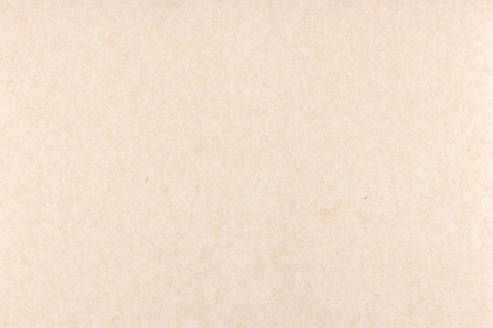 Decorative cream kraft paper texture. Decorated handmade craft paper background. Landscape horizontal orientation.