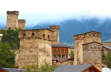 Group of Ancient Svan Tower-houses in the Mist, Incredible UNESCO World Heritage Site in Mestia, Svaneti Region of Georgia