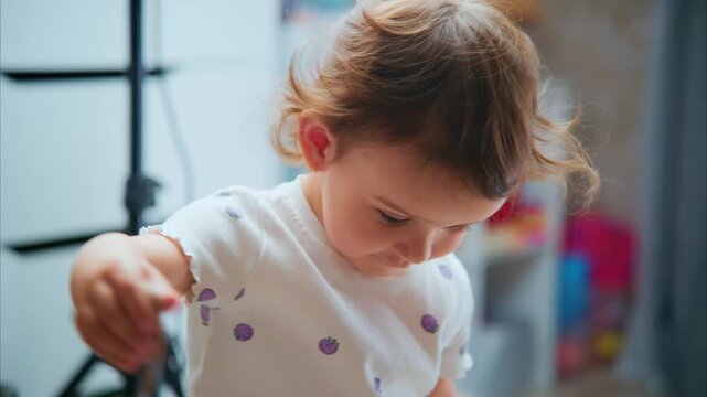 A Curious Child Engaging with a Toy: Capturing the Wonder of Exploration and Joy in Playtime Moments at Home