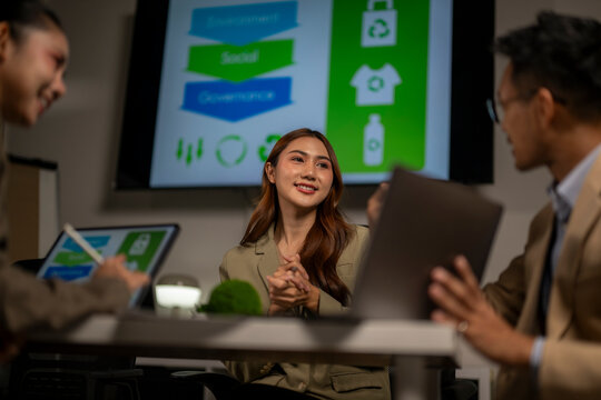 Asian business people discussing esg environment social governance - Powered by Adobe