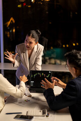 Analyzing stock market data, business people arguing during late night meeting