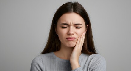 Woman with Toothache Holding Cheek in Pain