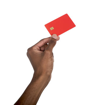 Hand holding red bank card with chip in raised position. Black skin male showing secure cashless