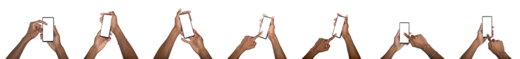 Naklejka na ściany i meble Hand holding smartphone with blank screen in mockup set. Black skin male using digital device for Naklejka na ściany i meble Hand holding smartphone with blank screen in mockup set. Black skin male using digital device for