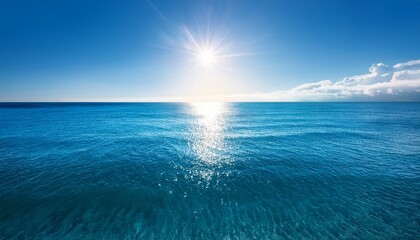 Obraz premium The Ocean Is Calm And Clear With A Bright Sun Shining Through The Water