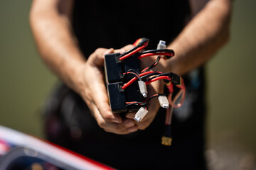 Technician holding lithium polymer batteries for drone or rc model