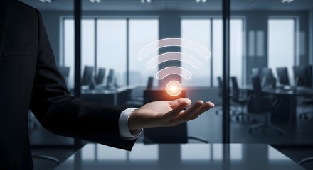 Businessman presenting glowing wifi signal over modern office workspace, connectivity and network concept.