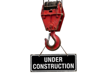 Yellow under construction sign hanging from crane hook isolated on transparent background