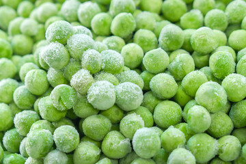 Frozen green peas texture background.