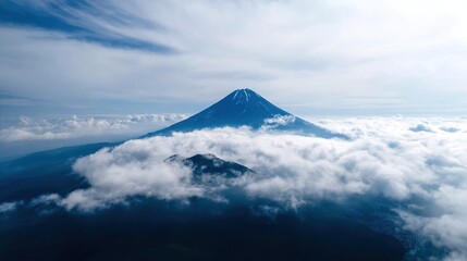 Majestic mountain peaks shrouded in a light mist, with lush green hills. A breathtaking scene showcasing the height of the mountains and the distant scenery.