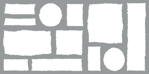 Collection of various white torn paper scraps and circles with rough edges