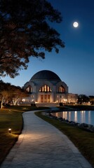 Obraz premium Majestic Architecture Under Moonlight by Tranquil Water Reflection in a Serene Evening Setting