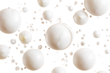 Creamy, round, white blobs on black