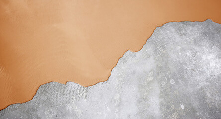 The concrete floor is orange painted. Contractor will paint garage floor to accelerate home sale