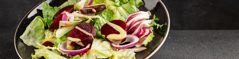 Beet salad green leaf lettuce vegetables natural product tasty snack fresh delicious gourmet food background on the table rustic top view copy space keto and paleo diet vegan and vegan food