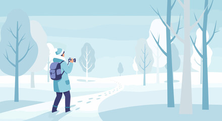 Photographer Capturing Winter Scene With Backpack In Snowy Landscape
