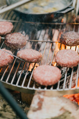 A grill with a bunch of hamburgers on it