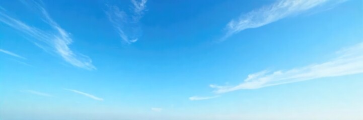 Fototapeta premium Vast expanse of a clear blue sky subtly veiled by wispy, high-altitude cirrus clouds, creating a serene and ethereal atmosphere Perfect for travel, weather, or nature-themed projects , scenic, day