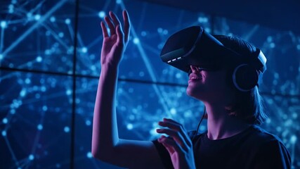 Young woman wearing a vr headset, immersed in a futuristic digital world with glowing blue network connections all around her - Powered by Adobe