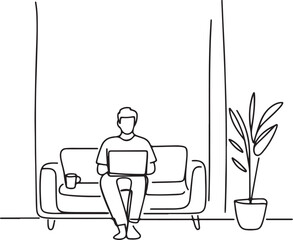 Freelancer working on laptop at home on the sofa