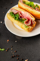 Ham sandwich green leaf salad, spam, meat snack vegetables natural product tasty tasty snack fresh delicious gourmet food background on the table rustic top view copy space
