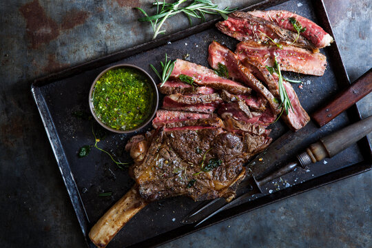 Ribeye beef steak grilled with herb sauce