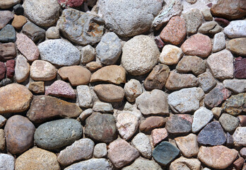 Rocks embedded in concrete on a city street island