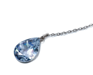 Elegant teardrop gemstone pendant on a silver chain with sparkling facets, perfect for fashion and jewelry photography
