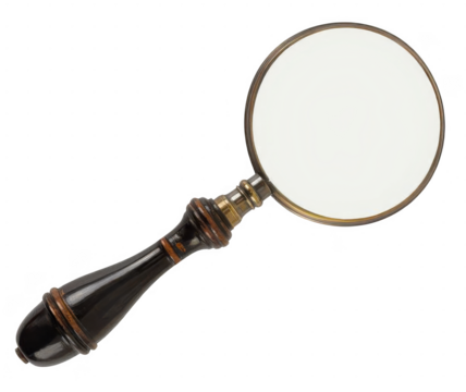 Vintage magnifying glass with an ornate dark handle isolated.