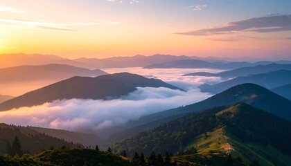 Moody landscape of majestic mountain ridges at sunrise, with a sea of clouds and fog rolling through the scenic valley