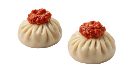 Traditional Asian steamed momo dumplings topped with spicy red chili paste for menu design. isolated PNG with Transparent Background