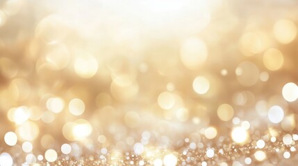 Obraz premium A shimmering, golden bokeh background filled with soft, blurred lights, creating a warm and inviting atmosphere.