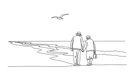 Elderly couple walking hand in hand along the beach at sunset  