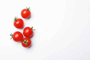 Fresh ripe tomatoes on white background, flat lay