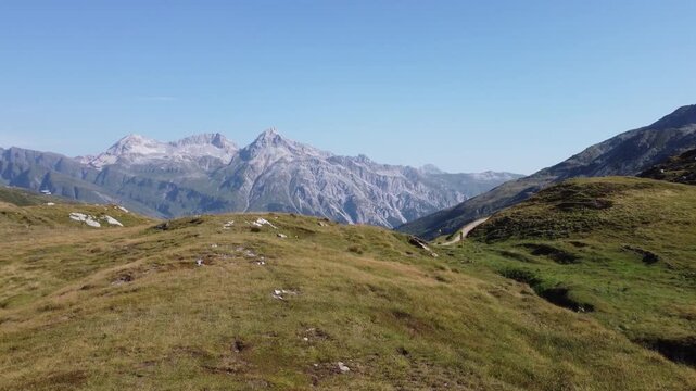 Drone approaching Splugen Pass and Teurihorn in the Italian Alps