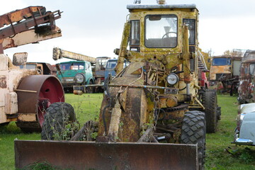 Grungy, Weathered Yellow Bulldozer in an Abandoned Heavy Equipment Junkyard