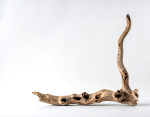 Fototapeta premium Natural driftwood sculpture against a clean white background